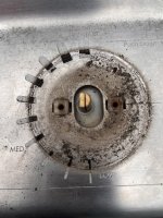 Burner with no knob or bezel showing missing paint.JPEG