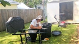 Closeup of Jon restoring grill.jpg